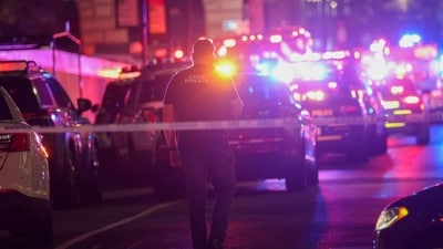 Police work at the scene of a fatal shooting in midtown Manhattan. (Getty Images via AFP) Police work at the scene of a fatal shooting in midtown Manhattan. (Getty Images via AFP)