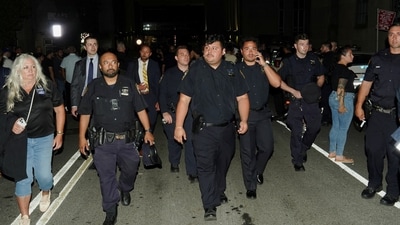 NYPD officers walked away after gathering to salute the ambulance transfer of slain officer Didarul Islam. (Reuters)