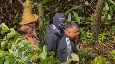 Members of the Special Investigation Team, constituted to probe the Dharmasthala mass burial case, investigate the site of the alleged burial, at Dharmasthala. (PTI) Members of the Special Investigation Team, constituted to probe the Dharmasthala mass burial case, investigate the site of the alleged burial, at Dharmasthala. (PTI)