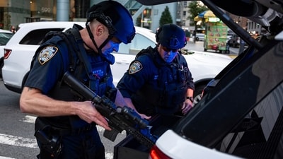 New York Police Department officers arrived at the corner of Lexington Avenue and 53rd Street, near a Manhattan office building, after the shooting. (AP) New York Police Department officers arrived at the corner of Lexington Avenue and 53rd Street, near a Manhattan office building, after the shooting. (AP)