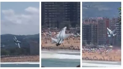 The EF-18 Hornet jet can be seen flying towards the beach at a very low altitude when it executes a sudden hard right roll. (X) The EF-18 Hornet jet can be seen flying towards the beach at a very low altitude when it executes a sudden hard right roll. (X)
