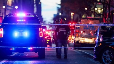 Police and others gather at a crime scene in midtown Manhattan after two people, including a police officer, were shot inside of an office building on July 28, 2025 in New York City. (Photo by SPENCER PLATT / GETTY IMAGES NORTH AMERICA / Getty Images via AFP) (Getty Images via AFP) Police and others gather at a crime scene in midtown Manhattan after two people, including a police officer, were shot inside of an office building on July 28, 2025 in New York City. (Photo by SPENCER PLATT / GETTY IMAGES NORTH AMERICA / Getty Images via AFP) (Getty Images via AFP)