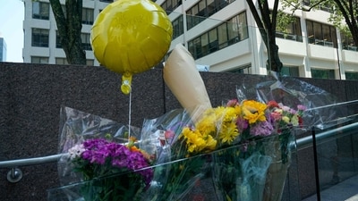 Flowers and a balloon reading "Love one another" are left outside the 345 Park Avenue building, the scene of last night's deadly shootings in Midtown Manhattan in New York on July 29, 2025. (AFP) Flowers and a balloon reading "Love one another" are left outside the 345 Park Avenue building, the scene of last night's deadly shootings in Midtown Manhattan in New York on July 29, 2025. (AFP)