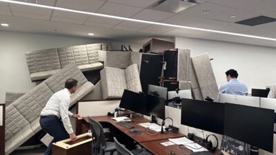 Employees in business attire were reportedly seen piling couches up against their office door in an attempt to protect themselves. (X/@JorgeFNAVA) Employees in business attire were reportedly seen piling couches up against their office door in an attempt to protect themselves. (X/@JorgeFNAVA)