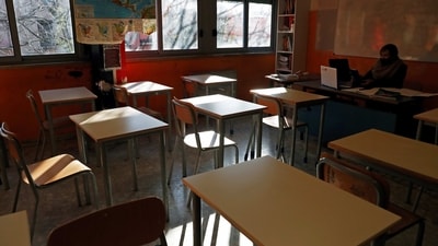 A teacher sits in a classroom, amidst the pandemic as schools promotes social distancing and online learning. (For representation/REUTERS)