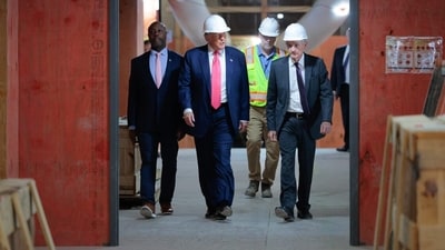 President Trump made a surprise visit to the Federal Reserve last week to tour its headquarters renovation. He later said he made his case to Fed Chair Jerome Powell, right, for lower interest rates. President Trump made a surprise visit to the Federal Reserve last week to tour its headquarters renovation. He later said he made his case to Fed Chair Jerome Powell, right, for lower interest rates.