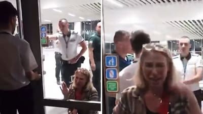As other passengers watched from behind a glass door, the woman fell to her knees and wept as she continued pleading. (Facebook/Nikolay Stefanov) As other passengers watched from behind a glass door, the woman fell to her knees and wept as she continued pleading. (Facebook/Nikolay Stefanov)