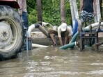 Corporation officials claimed that their staff and teams were roped in at different waterlogging points since Tuesday morning. (Sakib Ali/HT Photos) Corporation officials claimed that their staff and teams were roped in at different waterlogging points since Tuesday morning. (Sakib Ali/HT Photos)