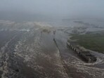 Tsunami waves flood an area after a powerful magnitude 8.8 earthquake struck off Russia's far eastern Kamchatka Peninsula. 
