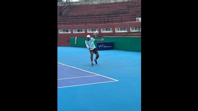 A player in action at Chandigarh Lawn Tennis Association Stadium, Sector 10, on Wednesday. (HT Photo)