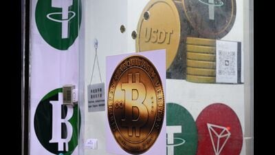 A trusted, low-cost stablecoin backed either by the dollar or US government bonds will slowly replace other ways of moving money across borders. (AFP)