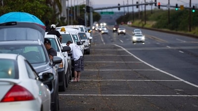 Oahu residents evacuate Ewa Beach to the side of Kunia Road due to the threat of tsunami in Kapolei, Oahu, Hawaii, Tuesday, July 29, 2025. AP/PTI(AP07_30_2025_000139A) (AP) Oahu residents evacuate Ewa Beach to the side of Kunia Road due to the threat of tsunami in Kapolei, Oahu, Hawaii, Tuesday, July 29, 2025. AP/PTI(AP07_30_2025_000139A) (AP)