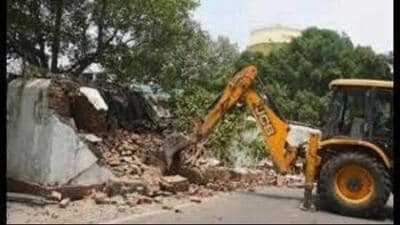 According to police, the property, owned by Ankur Singla alias Kaka, was razed around 2pm under the supervision of deputy commissioner of police (Investigation) Harpal Singh. (HT Photo)