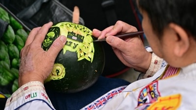 A talented fan carving an image of Ozzy Osbourne on a melon, showcasing the wide ranging influence of his music on all kinds of art forms. (Ben STANSALL/AFP) A talented fan carving an image of Ozzy Osbourne on a melon, showcasing the wide ranging influence of his music on all kinds of art forms. (Ben STANSALL/AFP)