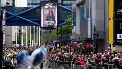 A wide angle shot that showcases the dedication of fans that assembled as Ozzy Osbourne was laid to rest, along with a full view of a billboard that says, “Birmingham will always love you.” (AP) A wide angle shot that showcases the dedication of fans that assembled as Ozzy Osbourne was laid to rest, along with a full view of a billboard that says, “Birmingham will always love you.” (AP)