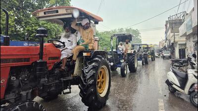 Farmers taking out a tractor march in Sangrur on a rainy Wednesday morning in response to the call given by the Samyukt Kisan Morcha to protest the AAP government’s land-pooling policy. (HT Photo) Farmers taking out a tractor march in Sangrur on a rainy Wednesday morning in response to the call given by the Samyukt Kisan Morcha to protest the AAP government’s land-pooling policy. (HT Photo)