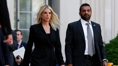 Attorney General Pam Bondi and FBI Director Kash Patel walk to attend a press conference to make an announcement (REUTERS)