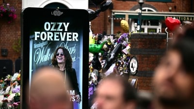 A close up shot of a billboard honouring the heavy metal hell-raiser that reads “Ozzy Forever”, on a street in Birmingham lined with mourners and music fans. (Ben STANSALL/AFP) A close up shot of a billboard honouring the heavy metal hell-raiser that reads “Ozzy Forever”, on a street in Birmingham lined with mourners and music fans. (Ben STANSALL/AFP)