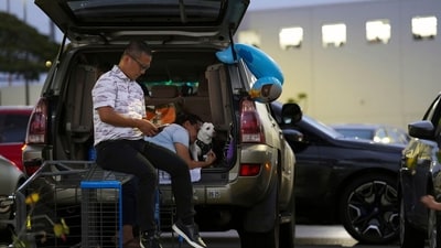 Oahu residents seek refuge from the threat of tsunami in a Walmart parking lot in Kapolei, Oahu, Hawaii, Tuesday, July 29, 2025. (AP photo/Michelle Bir) (AP) Oahu residents seek refuge from the threat of tsunami in a Walmart parking lot in Kapolei, Oahu, Hawaii, Tuesday, July 29, 2025. (AP photo/Michelle Bir) (AP)