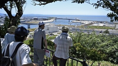 People watch the coastal area from Hiyoriyama Park after Japan issued evacuation alert following major quake in Russia's Kamchatka Peninsula that triggered a tsunami warning, in Ishinomaki, Miyagi prefecture, Japan July 30, 2025 (Reuters)