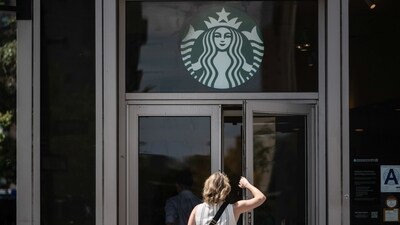 One of Starbucks' major bets is on a new customer service model called the "Green Apron Service. (Bloomberg) One of Starbucks' major bets is on a new customer service model called the "Green Apron Service. (Bloomberg)