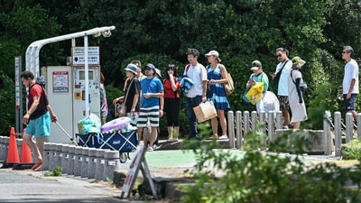 Tourists at a parking queue at Inage Seaside Park, as evacuation alerts were issued throughout much of coastal Japan, along Tokyo Bay in Chiba City. (AFP) Tourists at a parking queue at Inage Seaside Park, as evacuation alerts were issued throughout much of coastal Japan, along Tokyo Bay in Chiba City. (AFP)
