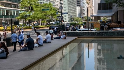 People sit next to a fountain in Manhattan as the region experiences another heatwave on July 29, 2025 in New York City. Temperatures are expected to reach into the high 90s with a heat index well above 100 degrees. Spencer Platt/Getty Images/AFP (Photo by SPENCER PLATT / GETTY IMAGES NORTH AMERICA / Getty Images via AFP) (Getty Images via AFP) People sit next to a fountain in Manhattan as the region experiences another heatwave on July 29, 2025 in New York City. Temperatures are expected to reach into the high 90s with a heat index well above 100 degrees. Spencer Platt/Getty Images/AFP (Photo by SPENCER PLATT / GETTY IMAGES NORTH AMERICA / Getty Images via AFP) (Getty Images via AFP)