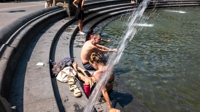 People cool off in a fountain in Washington Square Park as the region experiences another heatwave on July 29, 2025 in New York City. (Getty Images via AFP) People cool off in a fountain in Washington Square Park as the region experiences another heatwave on July 29, 2025 in New York City. (Getty Images via AFP)