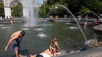 People enjoy in a fountain in Washington Square Park as the region experiences another heatwave on July 29, 2025 in New York City. (Getty Images via AFP) People enjoy in a fountain in Washington Square Park as the region experiences another heatwave on July 29, 2025 in New York City. (Getty Images via AFP)