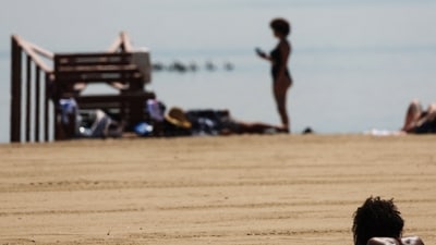 On Sunday, the temperature at Tampa International Airport reached 100 degrees Fahrenheit (37.8 degrees Celsius), breaking the previous record. In June 2020, the previous record was 99 F (37.2 C).A woman sunbathes during a heatwave affecting the U.S. Northeast at Orchard Beach in the Bronx borough of New York City, July 29, 2025. REUTERS/Shannon Stapleton (REUTERS)