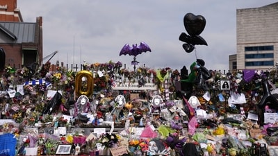 Floral tributes and inflatable bats from fans honouring the “Children of the Grave” vocalist, known for his infamous stage antics, who once bit the head off a live bat at one of his concerts. (AP) Floral tributes and inflatable bats from fans honouring the “Children of the Grave” vocalist, known for his infamous stage antics, who once bit the head off a live bat at one of his concerts. (AP)