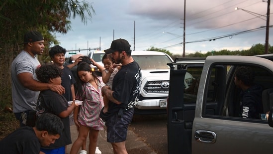 Tsunami warnings in US: Ewa Beach residents Carlo Salas and CJ Jasper, with their families, are evacuated at the side of Kunia Road to escape the tsunami threat Kapolei, Oahu, Hawaii, Tuesday, July 29, 2025. (AP photo/Michelle Bir) (AP)