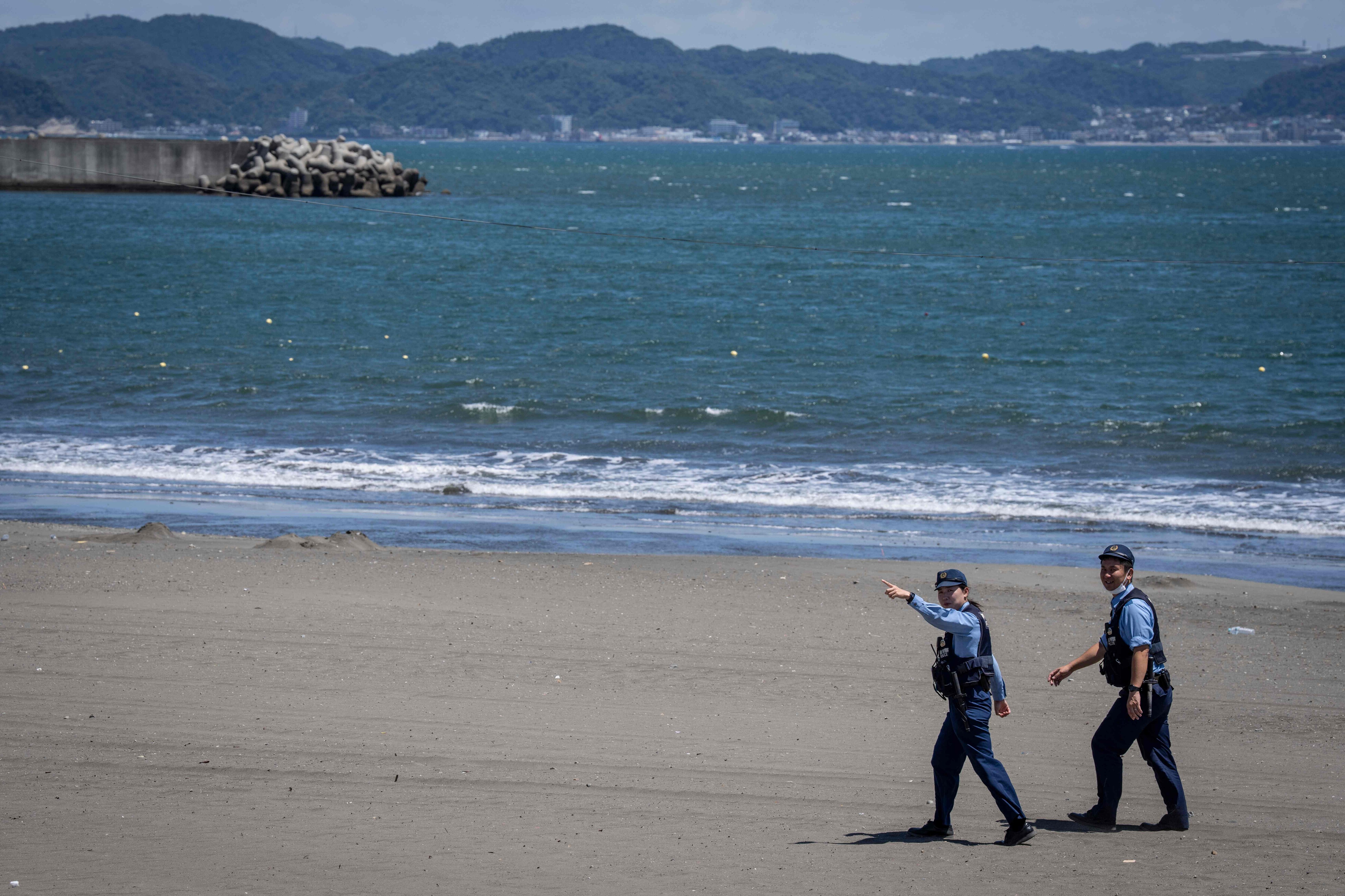 Police officers ask people to evacuate an empty beach due to a tsunami warning in Fujisawa city, Kanagawa prefecture on July 30, 2025. Tsunamis hit parts of Russia's Far East and Japan on July 30 after a huge magnitude 8.8 earthquake, with warnings in place around the Pacific of waves of over three metres (10 feet) in places. (AFP) Police officers ask people to evacuate an empty beach due to a tsunami warning in Fujisawa city, Kanagawa prefecture on July 30, 2025. Tsunamis hit parts of Russia's Far East and Japan on July 30 after a huge magnitude 8.8 earthquake, with warnings in place around the Pacific of waves of over three metres (10 feet) in places. (AFP)