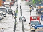 A car stuck on a waterloggged strech in Gurugram. (Parveen Kumar/Hindustan Times)