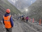 A member of the Jammu and Kashmir Police’s Mountain Rescue Team (MRT) stands guard as pilgrims move towards the holy cave shrine during the annual Amarnath Yatra in Anantnag district on Thursday. (PTI Photo) A member of the Jammu and Kashmir Police’s Mountain Rescue Team (MRT) stands guard as pilgrims move towards the holy cave shrine during the annual Amarnath Yatra in Anantnag district on Thursday. (PTI Photo)
