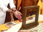 India's Minister of Culture and Tourism Gajendra Singh Shekhawat prays after he received repatriated sacred Piprahwa Gems of the Historical Buddha.