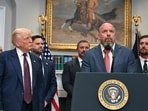 US President Donald Trump listens as WWE CCO Triple H speaks in the Roosevelt Room of the White House in Washington, DC. US President Donald Trump listens as WWE CCO Triple H speaks in the Roosevelt Room of the White House in Washington, DC.