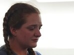 Miriam Meservy returns to her seat after making a statement after her father, dentist James Craig, had a verdict rendered in his murder trial in the district court in Arapahoe County, Colorado.