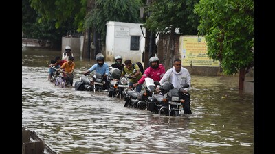 Commuters wade through a waterlogged stretch on NH-48 service road near Narsinghpur village in Gurugram on Thursday. (PARVEEN KUMAR) Commuters wade through a waterlogged stretch on NH-48 service road near Narsinghpur village in Gurugram on Thursday. (PARVEEN KUMAR)
