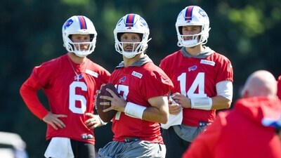 Buffalo Bills quarterback Josh Allen (17), center, looks to throw as quarterbacks Shane Buechele (6) and Mike White (14) watch (AP) Buffalo Bills quarterback Josh Allen (17), center, looks to throw as quarterbacks Shane Buechele (6) and Mike White (14) watch (AP)