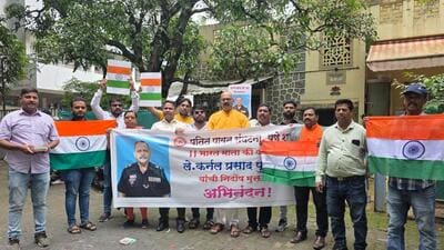 Members of the right-wing organisation Patit Pawan Sanghatana, along with residents from Erandwane, gathered near the residence, displaying congratulatory banners, waving saffron flags, bursting crackers, and distributing sweets. (HT PHOTO)
