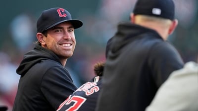 Former Cleveland Guardians' Shane Bieber stands in the dugout during the third inning of a baseball game against the Los Angeles Angels (AP) Former Cleveland Guardians' Shane Bieber stands in the dugout during the third inning of a baseball game against the Los Angeles Angels (AP)