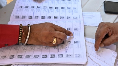 Mumbai, India. Nov 20, 2024: People searching for their name in the voting list outside a Polling station in the Ghatkopar area during the Maharashtra State Assembly elections in Mumbai. Mumbai, India. Nov 20, 2024. (Photo by Raju Shinde/HT Photo) (Hindustan Times) Mumbai, India. Nov 20, 2024: People searching for their name in the voting list outside a Polling station in the Ghatkopar area during the Maharashtra State Assembly elections in Mumbai. Mumbai, India. Nov 20, 2024. (Photo by Raju Shinde/HT Photo) (Hindustan Times)