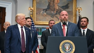 US President Donald Trump listens as WWE CCO Triple H speaks in the Roosevelt Room of the White House in Washington, DC. (AFP) US President Donald Trump listens as WWE CCO Triple H speaks in the Roosevelt Room of the White House in Washington, DC. (AFP)