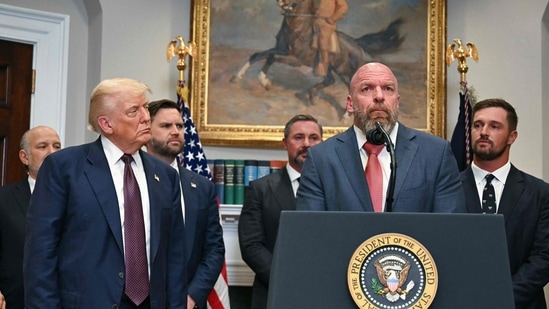 US President Donald Trump listens as WWE CCO Triple H speaks in the Roosevelt Room of the White House in Washington, DC. (AFP)