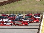 Car carrier trailers transporting Ford vehicles enter the US from Mexico at the Nogales-Mariposa port of entry on the US-Mexico border in Nogales, Arizona, US,