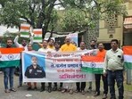 Members of the right-wing organisation Patit Pawan Sanghatana, along with residents from Erandwane, gathered near the residence, displaying congratulatory banners, waving saffron flags, bursting crackers, and distributing sweets. (HT PHOTO) Members of the right-wing organisation Patit Pawan Sanghatana, along with residents from Erandwane, gathered near the residence, displaying congratulatory banners, waving saffron flags, bursting crackers, and distributing sweets. (HT PHOTO)