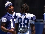 Dallas Cowboys defensive end Micah Parsons, left, talks with wide receiver CeeDee Lamb during training camp Thursday Dallas Cowboys defensive end Micah Parsons, left, talks with wide receiver CeeDee Lamb during training camp Thursday