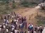 People gather after two groups clashed over a social media post, in Yavat in Pune's Daund tehsil, Friday.