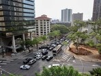 Beachgoers gather at Waikiki Beach after authorities downgraded earlier tsunami warnings following an earthquake